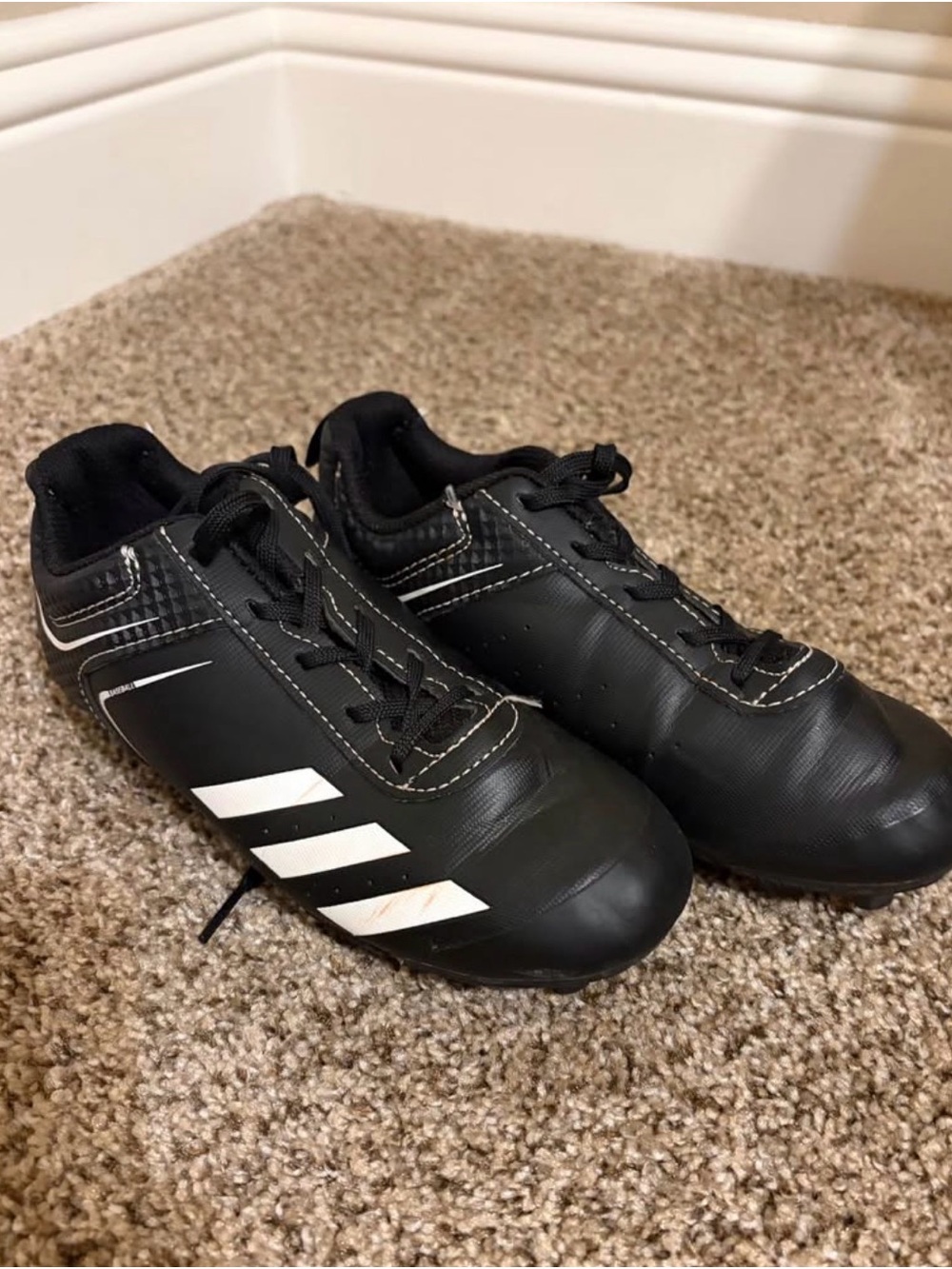 Boys Adidas Black Athletic Cleats with White Accents
